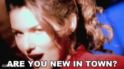 A Close Up Of A Woman With The Words " Are You New In Town " Above Her GIF