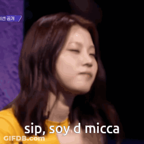 A Close Up Of A Woman With The Words Sip Soy D Micca Above Her GIF