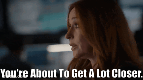 A Close Up Of A Woman With The Words You 'Re About To Get A Lot Closer Below Her GIF