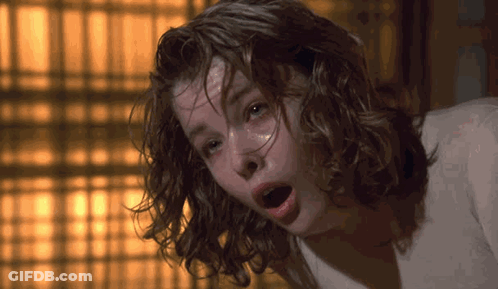 A Close Up Of A Woman With Wet Hair And Her Mouth Open GIF