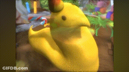 A Close Up Of A Yellow Cartoon Character With A Green Head GIF