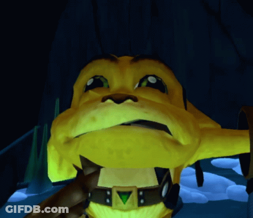 A Close Up Of A Yellow Cartoon Character With A Green Triangle On His Chest GIF