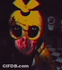 A Close Up Of A Yellow Chicken With Blood On Its Face GIF