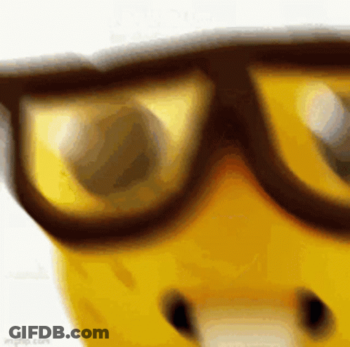 A Close Up Of A Yellow Object Wearing Sunglasses . GIF
