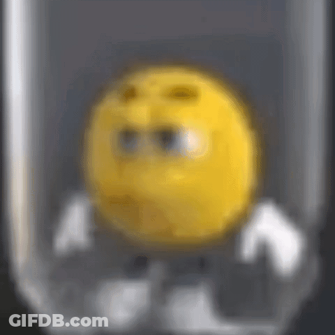 A Close Up Of A Yellow Smiley Face In A Glass GIF