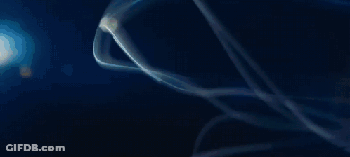A Close Up Of A Yellow Sphere With A Lot Of Bubbles In It . GIF