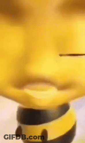 A Close Up Of A Yellow Toy That Looks Like A Bee Spinning On A Spinning Top . GIF