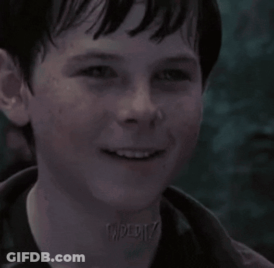 A Close Up Of A Young Boy 'S Face With A Watermark On His Neck That Says " Taperiz " GIF