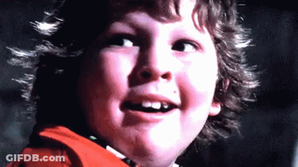 A Close Up Of A Young Boy 'S Face With His Mouth Open And His Teeth Missing . GIF