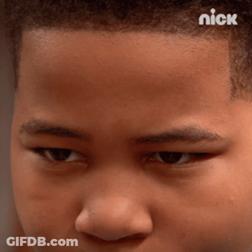 A Close Up Of A Young Boy 'S Face With The Nick Logo On The Bottom GIF
