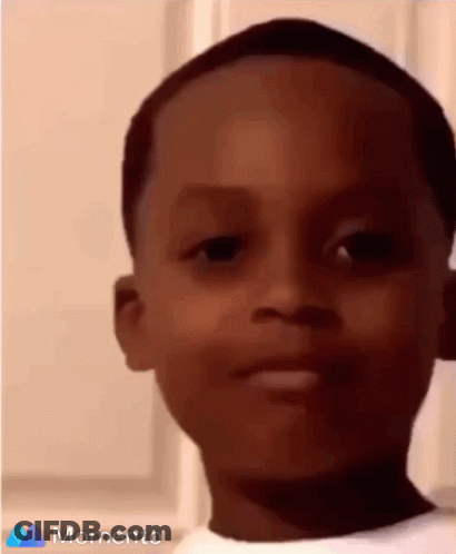 A Close Up Of A Young Boy 'S Face With The Words Momento On The Bottom GIF
