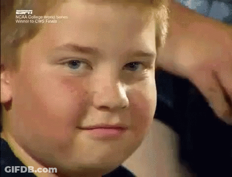 A Close Up Of A Young Boy 'S Face With The Words Ncaa College World Series Winner On The Bottom . GIF