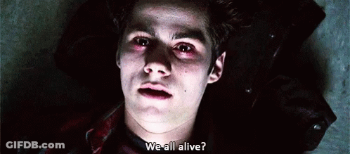 A Close Up Of A Young Man Laying On The Ground With Blood On His Face And A Question . GIF
