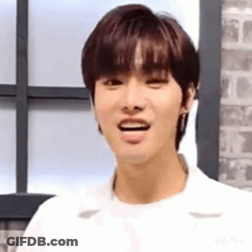 A Close Up Of A Young Man Making A Funny Face While Standing In Front Of A Window . GIF