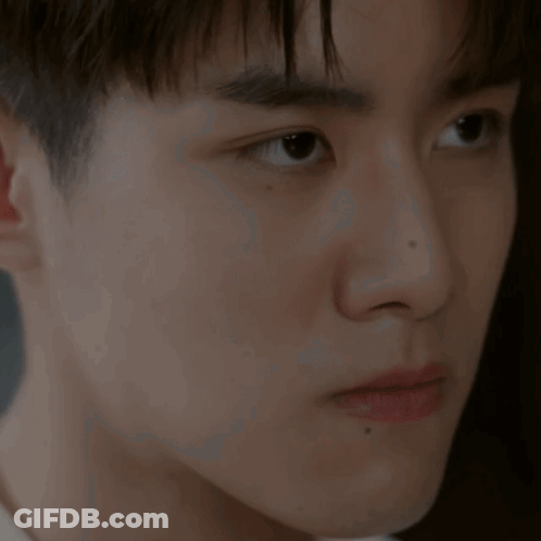 A Close Up Of A Young Man 'S Ear And Face GIF