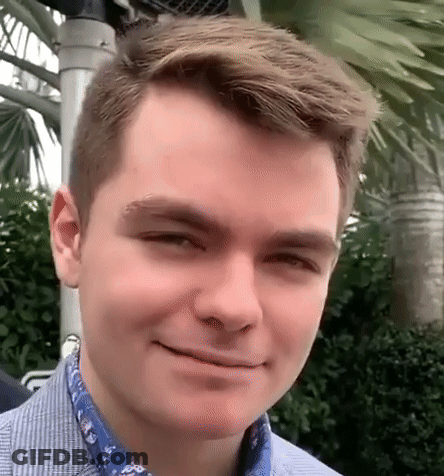 A Close Up Of A Young Man 'S Face Smiling GIF
