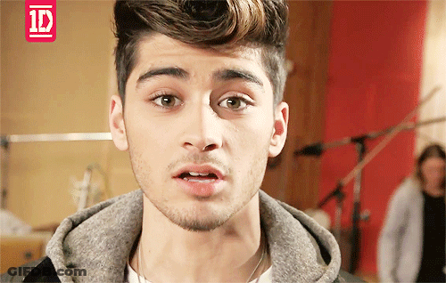 A Close Up Of A Young Man 'S Face With A 1D Logo In The Corner GIF