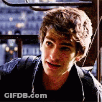 A Close Up Of A Young Man 'S Face With A Backpack . GIF