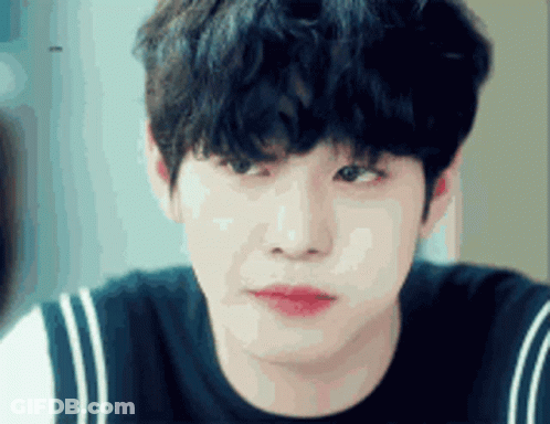 A Close Up Of A Young Man 'S Face With A Black Shirt On GIF