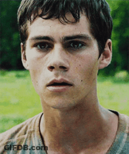 A Close Up Of A Young Man 'S Face With A Blurred Background GIF