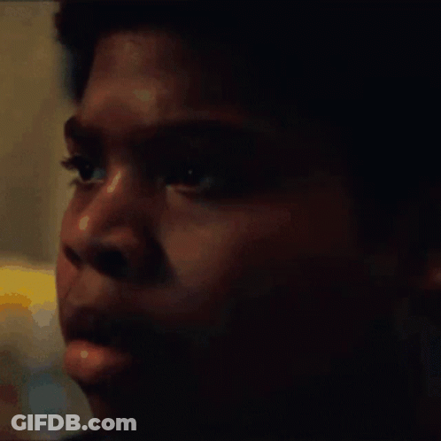A Close Up Of A Young Man 'S Face With A Blurred Background GIF