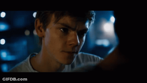 A Close Up Of A Young Man 'S Face With A Blurry Background GIF