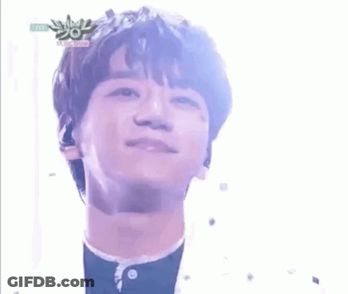 A Close Up Of A Young Man 'S Face With A Microphone In His Ear . GIF