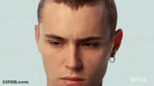 A Close Up Of A Young Man 'S Face With A Netflix Logo In The Corner GIF