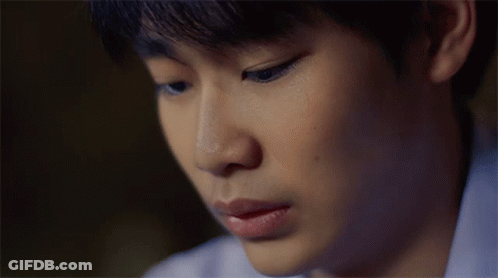 A Close Up Of A Young Man 'S Face With A Sad Look On His Face GIF