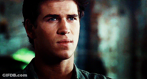 A Close Up Of A Young Man 'S Face With A Serious Look On His Face GIF