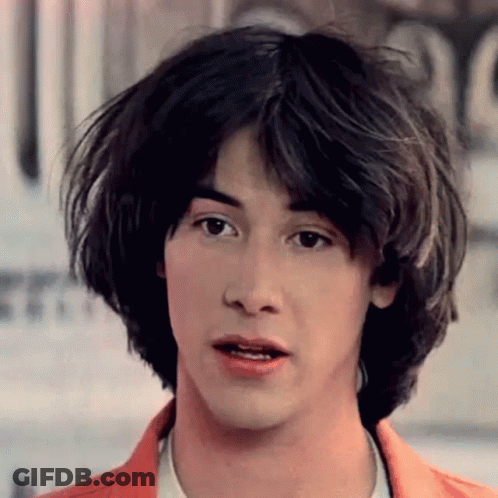 A Close Up Of A Young Man 'S Face With A Serious Look On His Face . GIF