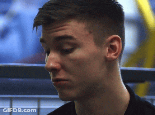 A Close Up Of A Young Man 'S Face With A Serious Look On His Face GIF