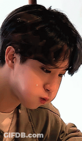 A Close Up Of A Young Man 'S Face With A Tear Coming Out Of His Nose GIF