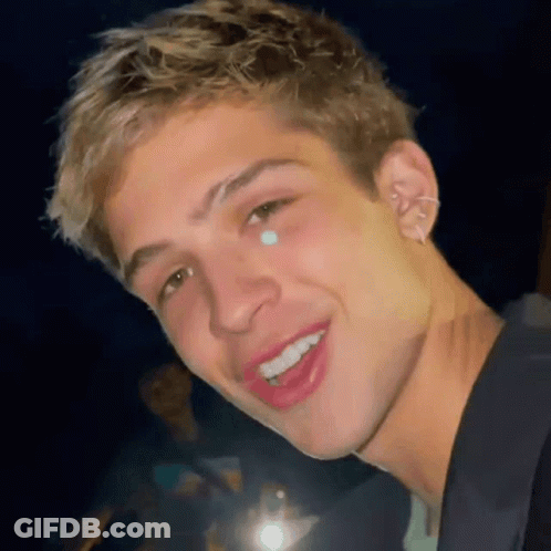 A Close Up Of A Young Man 'S Face With A Tear Coming Out Of His Nose . GIF