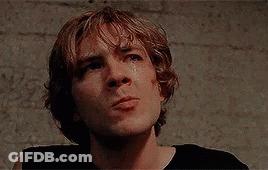 A Close Up Of A Young Man 'S Face With A Tear Running Down His Cheek . GIF