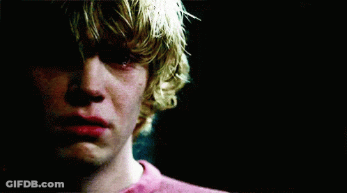 A Close Up Of A Young Man 'S Face With A Tear Running Down His Cheek . GIF