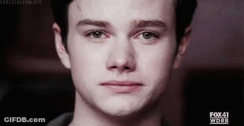 A Close Up Of A Young Man 'S Face With A Tear Running Down His Face . GIF