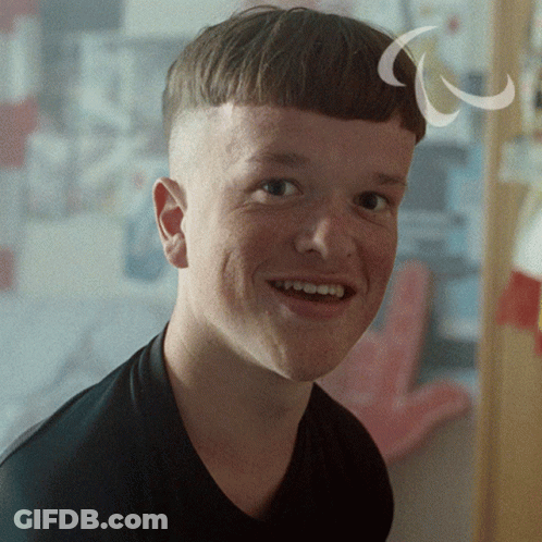 A Close Up Of A Young Man 'S Face With A White Circle Around His Head GIF