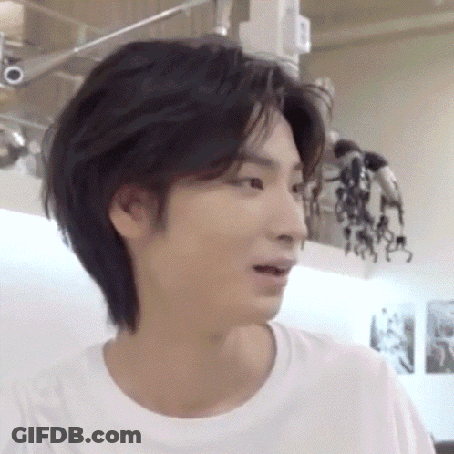 A Close Up Of A Young Man 'S Face With A White Shirt On GIF