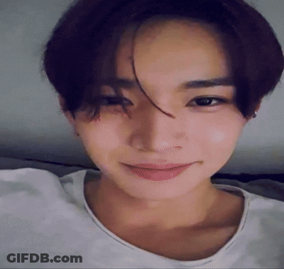A Close Up Of A Young Man 'S Face With A White Shirt On GIF