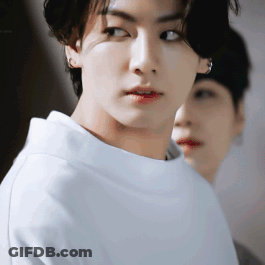 A Close Up Of A Young Man 'S Face With A Woman Behind Him . GIF