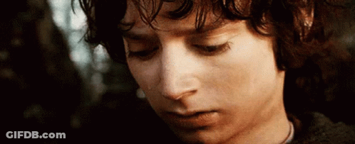A Close Up Of A Young Man 'S Face With His Eyes Closed And A Tear Running Down His Cheek . GIF