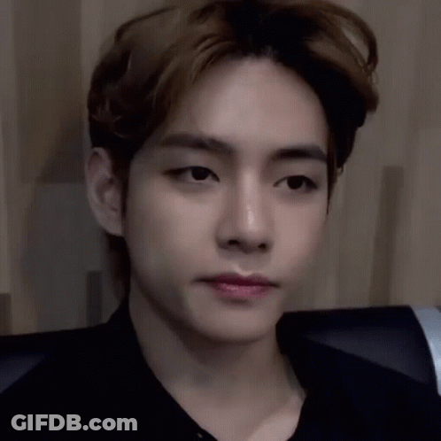 A Close Up Of A Young Man 'S Face With His Eyes Closed And His Mouth Open . GIF