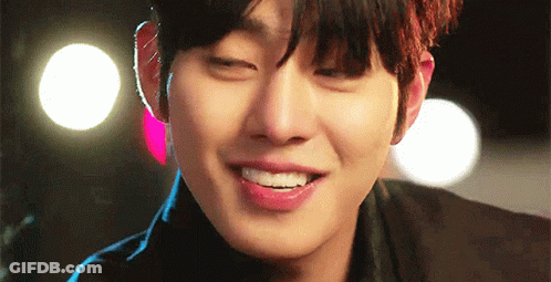 A Close Up Of A Young Man 'S Face With His Eyes Closed And His Mouth Open . GIF