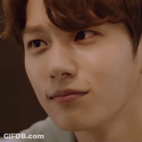 A Close Up Of A Young Man 'S Face With His Eyes Closed And His Mouth Open . GIF