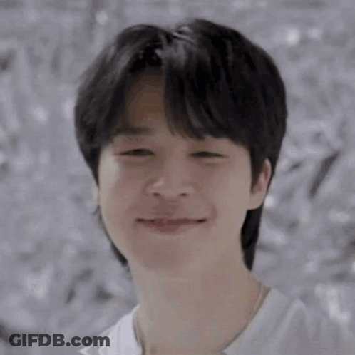 A Close Up Of A Young Man 'S Face With His Eyes Closed . GIF