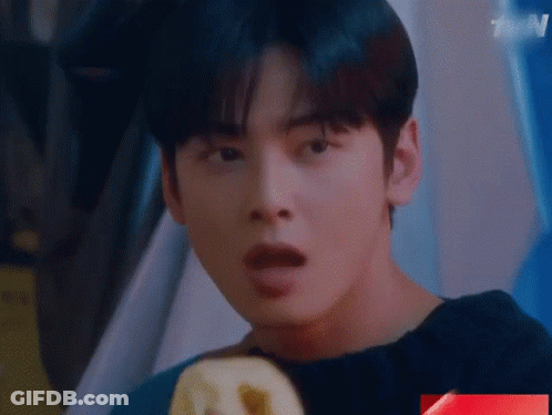 A Close Up Of A Young Man 'S Face With His Mouth Open . GIF
