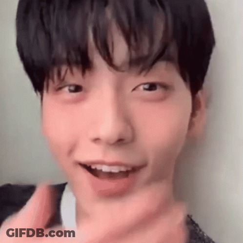 A Close Up Of A Young Man 'S Face With His Mouth Open And A Cigarette In His Mouth . GIF