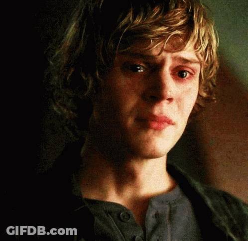 A Close Up Of A Young Man 'S Face With Tears Running Down His Cheeks GIF