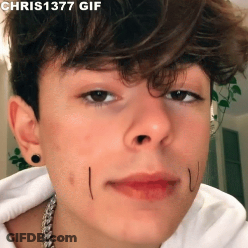 A Close Up Of A Young Man 'S Face With The Words Chris1377 Gif Above It GIF